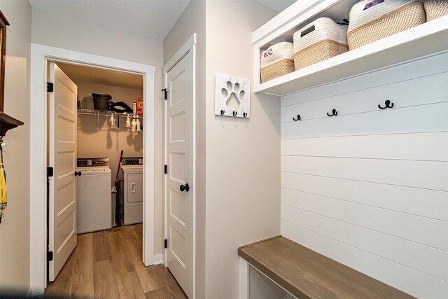 513 Walnut Dr, Huxley, IA 50124 - mudroom with separate washer and dryer and wood finished floors