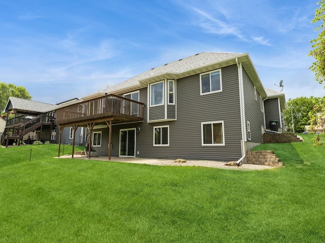 5213 SE 30th St, Des Moines, IA 50320 - rear view of house with a deck, a patio area, and a yard