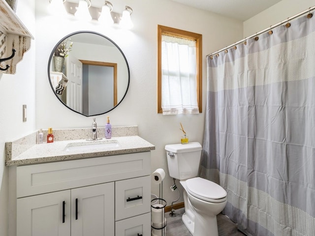 5213 SE 30th St, Des Moines, IA 50320 - bathroom featuring toilet, vanity, and a shower with shower curtain