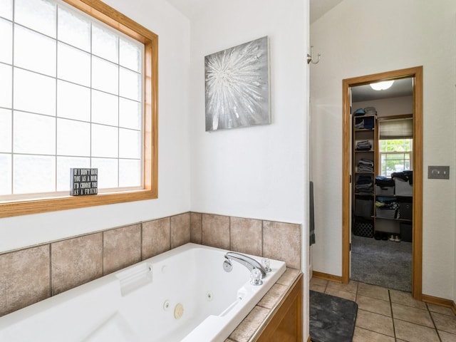 5213 SE 30th St, Des Moines, IA 50320 - full bath featuring a whirlpool tub, tile patterned flooring, and baseboards