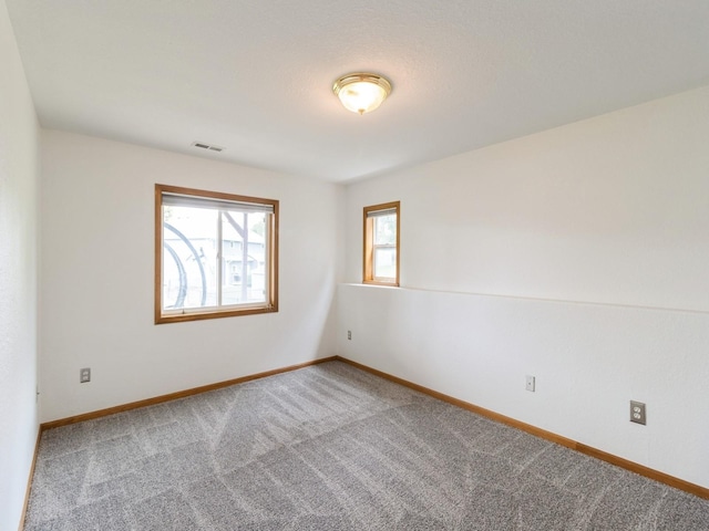 5213 SE 30th St, Des Moines, IA 50320 - empty room featuring carpet flooring and baseboards