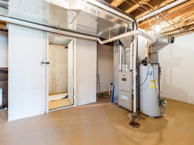 5213 SE 30th St, Des Moines, IA 50320 - unfinished basement featuring gas water heater, heating unit, and brick wall