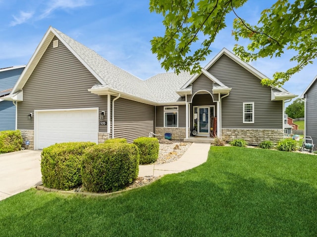 5213 SE 30th St, Des Moines, IA 50320 - view of front facade featuring stone siding, a garage, a front lawn, roof with shingles, and concrete driveway