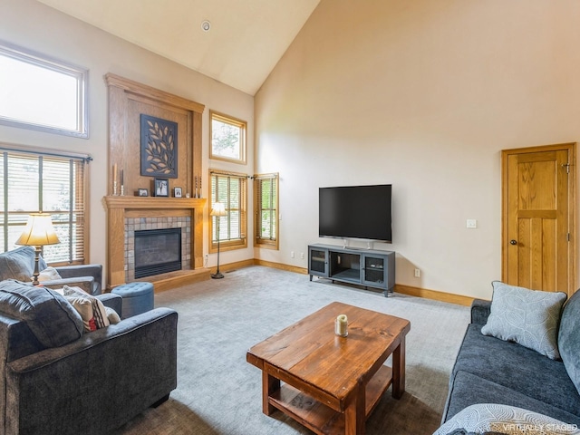 6818 Jules Verne Ct, Johnston, IA 50131 - carpeted living area with high vaulted ceiling, baseboards, and a fireplace