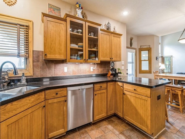 6818 Jules Verne Ct, Johnston, IA 50131 - kitchen with dishwasher, a sink, a peninsula, and healthy amount of natural light