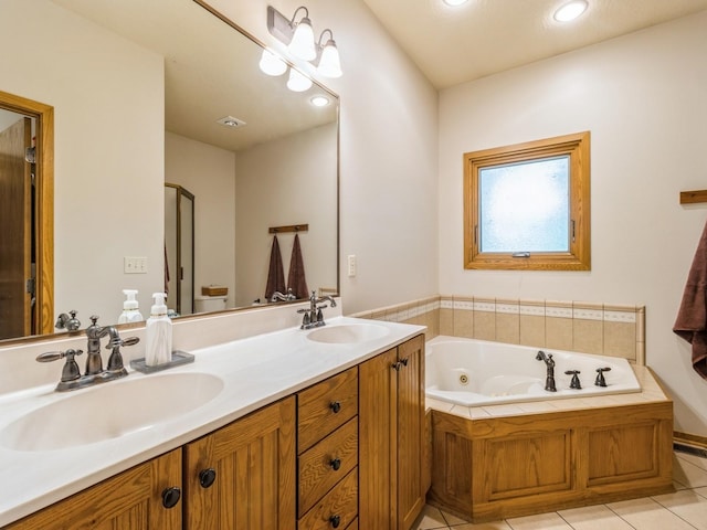 6818 Jules Verne Ct, Johnston, IA 50131 - bathroom with double vanity, a whirlpool tub, tile patterned flooring, and recessed lighting