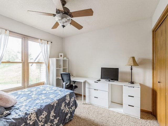 6818 Jules Verne Ct, Johnston, IA 50131 - bedroom featuring light carpet, an office area, baseboards, and a ceiling fan
