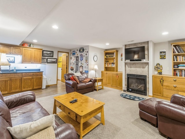 6818 Jules Verne Ct, Johnston, IA 50131 - living area featuring a fireplace, recessed lighting, light wood-type flooring, and baseboards