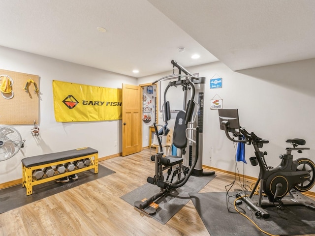 6818 Jules Verne Ct, Johnston, IA 50131 - exercise room with baseboards, light wood-style flooring, and recessed lighting