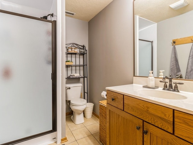6818 Jules Verne Ct, Johnston, IA 50131 - bathroom with a shower stall, toilet, vanity, a textured ceiling, and tile patterned floors