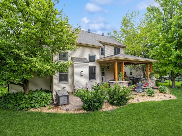 6818 Jules Verne Ct, Johnston, IA 50131 - rear view of property featuring a lawn, a patio, and roof with shingles