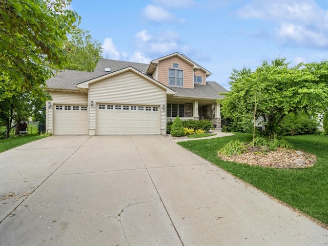 6818 Jules Verne Ct, Johnston, IA 50131 - view of front of home with an attached garage, driveway, a porch, a front lawn, and roof with shingles
