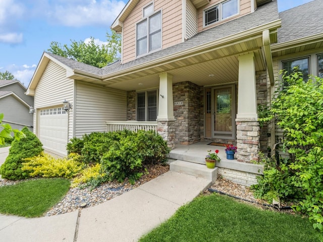 6818 Jules Verne Ct, Johnston, IA 50131 - property entrance featuring a porch, roof with shingles, an attached garage, and stone siding