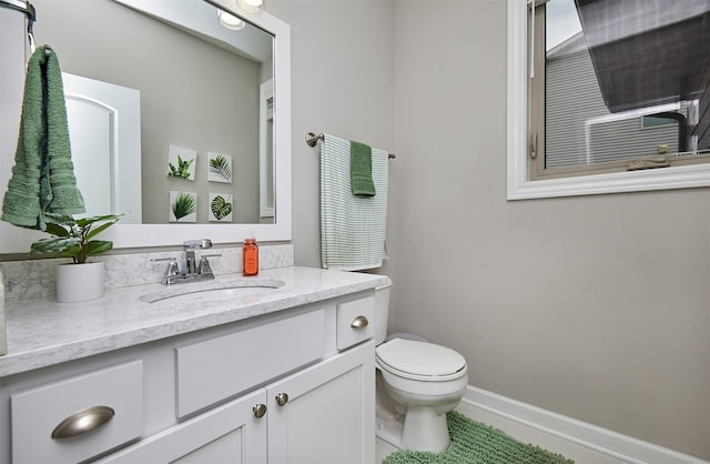 1880 Brodie St, Waukee, IA 50263 - bathroom featuring toilet, vanity, and tile patterned flooring