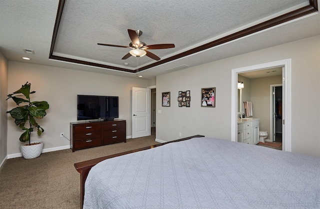 1880 Brodie St, Waukee, IA 50263 - bedroom with a tray ceiling, a textured ceiling, baseboards, carpet, and connected bathroom