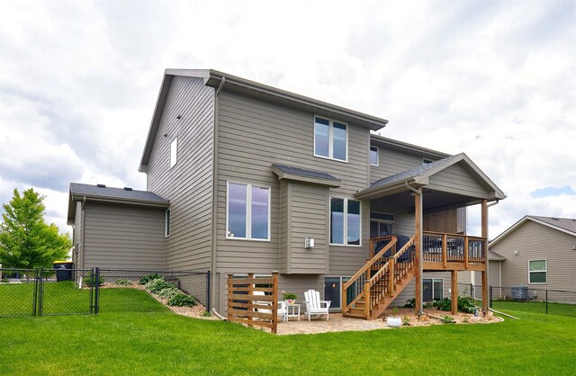 1880 Brodie St, Waukee, IA 50263 - back of property with stairs, central air condition unit, a gate, and a patio
