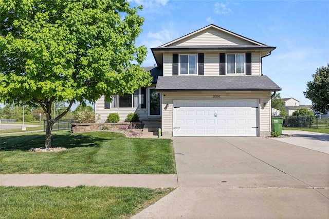 2004 Oak St, Granger, IA 50109 - view of front facade with concrete driveway and an attached garage
