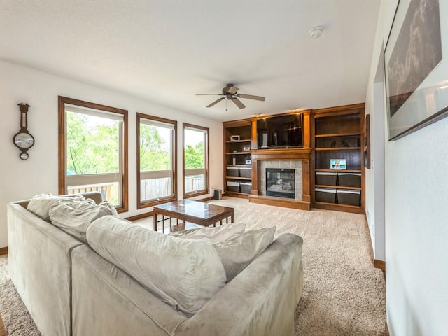 8305 Century Dr, West Des Moines, IA 50266 - carpeted living room with ceiling fan and a tiled fireplace