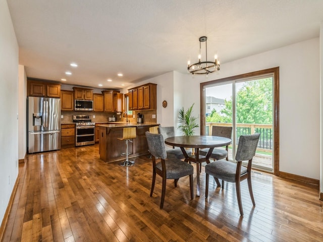 8305 Century Dr, West Des Moines, IA 50266 - dining space with a chandelier, dark wood-type flooring, and recessed lighting
