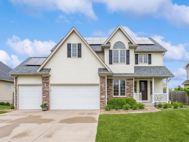 8305 Century Dr, West Des Moines, IA 50266 - traditional-style home featuring a porch, solar panels, concrete driveway, and a shingled roof