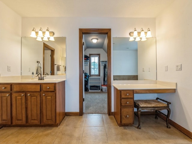 8305 Century Dr, West Des Moines, IA 50266 - full bath featuring vanity, a chandelier, tile patterned floors, lofted ceiling, and a walk in closet