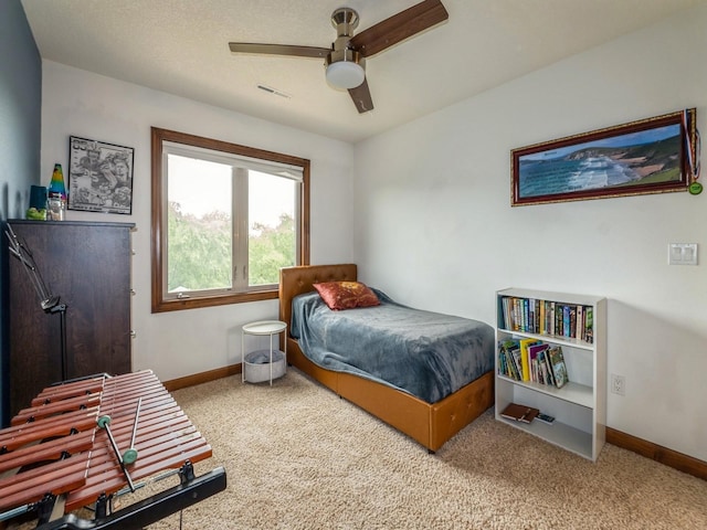 8305 Century Dr, West Des Moines, IA 50266 - carpeted bedroom with baseboards and a ceiling fan