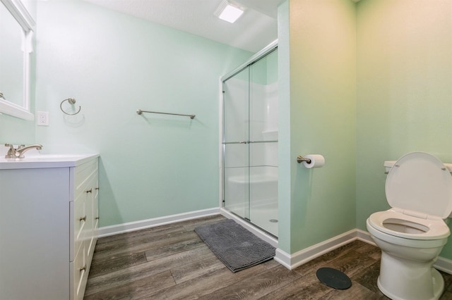 8305 Century Dr, West Des Moines, IA 50266 - full bathroom featuring wood finished floors, vanity, and a stall shower