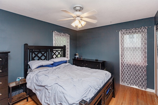 4006 67th St, Urbandale, IA 50322 - bedroom featuring light wood finished floors and ceiling fan