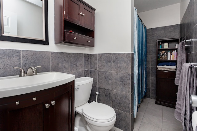 4006 67th St, Urbandale, IA 50322 - bathroom with tile walls, vanity, toilet, a shower with curtain, and tile patterned flooring
