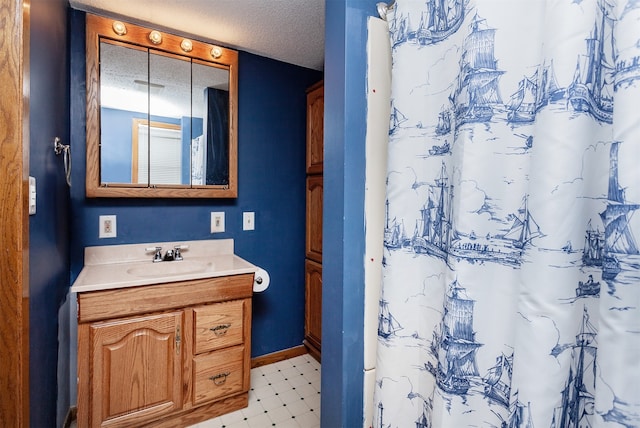 4006 67th St, Urbandale, IA 50322 - full bath featuring vanity, tile patterned floors, baseboards, and a shower with shower curtain