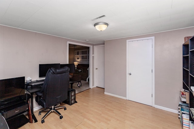 4006 67th St, Urbandale, IA 50322 - office area featuring light wood-type flooring, crown molding, and baseboards