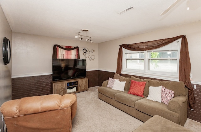 4006 67th St, Urbandale, IA 50322 - carpeted living room featuring wainscoting and ceiling fan
