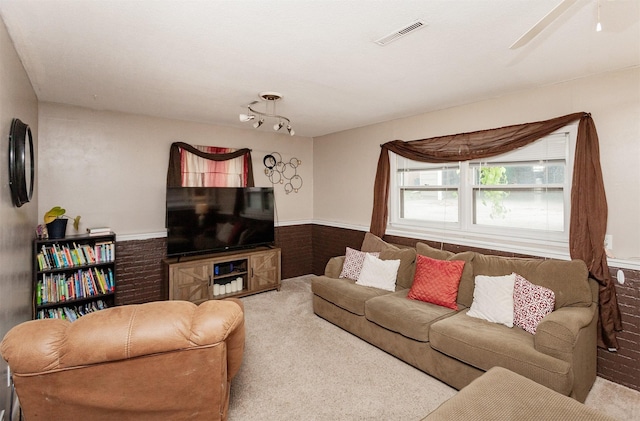 4006 67th St, Urbandale, IA 50322 - carpeted living area featuring a wainscoted wall and a ceiling fan