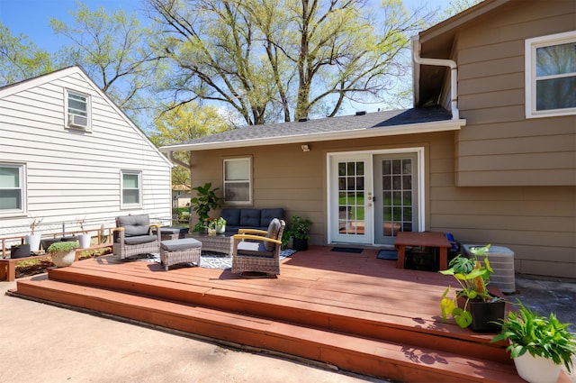 4006 67th St, Urbandale, IA 50322 - deck with an outdoor hangout area, french doors, and central air condition unit