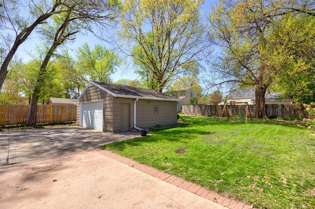 4006 67th St, Urbandale, IA 50322 - view of yard with an outdoor structure and a detached garage