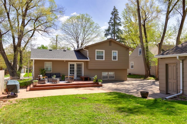 4006 67th St, Urbandale, IA 50322 - back of property featuring a wooden deck, french doors, an outdoor hangout area, and a patio