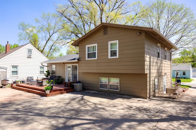 4006 67th St, Urbandale, IA 50322 - rear view of house with a wooden deck and a patio area