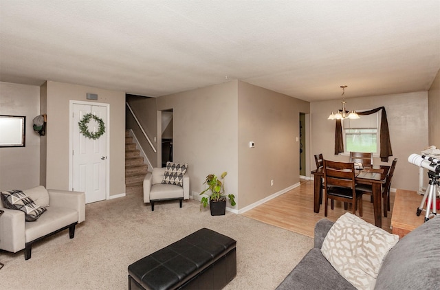 4006 67th St, Urbandale, IA 50322 - carpeted living room with a chandelier, stairway, and baseboards