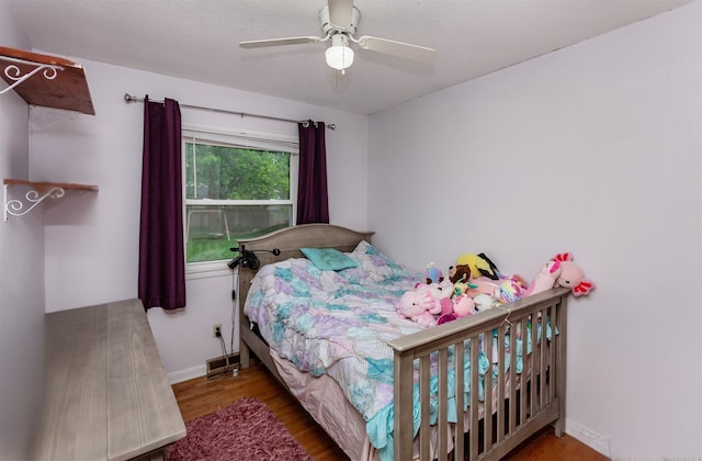 4006 67th St, Urbandale, IA 50322 - bedroom featuring wood finished floors, baseboards, and ceiling fan
