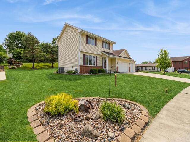 1506 W 17th St S, Newton, IA 50208 - view of front of home featuring an attached garage, a front lawn, concrete driveway, and cooling unit