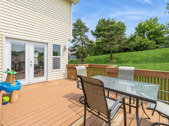 1506 W 17th St S, Newton, IA 50208 - deck with outdoor dining space, french doors, and a yard