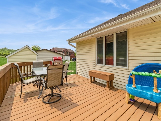 1506 W 17th St S, Newton, IA 50208 - wooden terrace featuring outdoor dining space and area for grilling