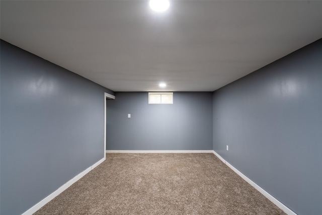 1452 55th St, Des Moines, IA 50311 - below grade area with carpet flooring and baseboards