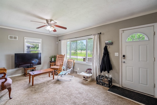 1452 55th St, Des Moines, IA 50311 - carpeted foyer featuring a ceiling fan, baseboards, and crown molding
