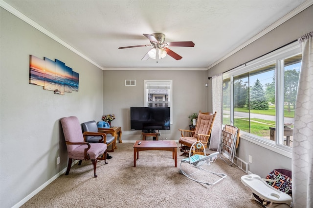 1452 55th St, Des Moines, IA 50311 - carpeted living area featuring a ceiling fan, plenty of natural light, ornamental molding, and baseboards