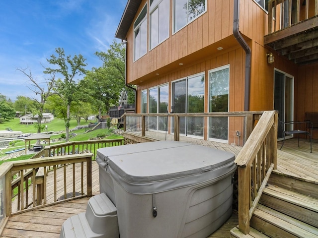 201 Cottage Ln, Montezuma, IA 50171 - wooden deck featuring a hot tub
