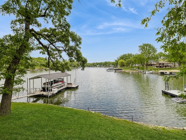 201 Cottage Ln, Montezuma, IA 50171 - dock area with a water view and a yard