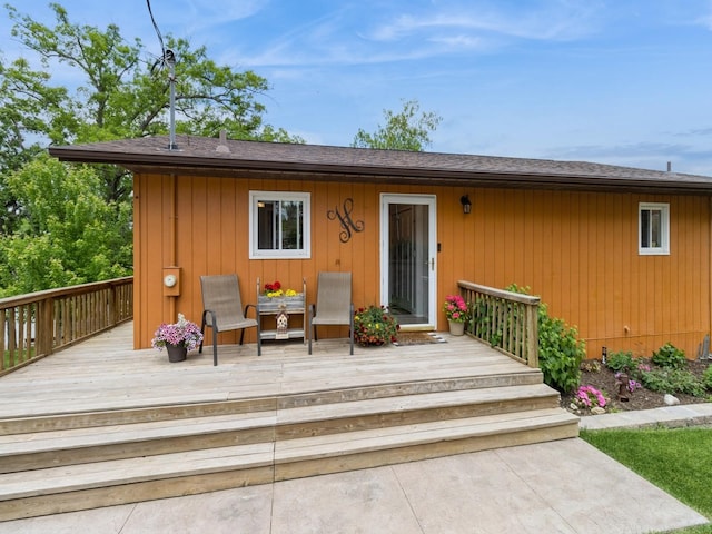 201 Cottage Ln, Montezuma, IA 50171 - property entrance featuring a wooden deck