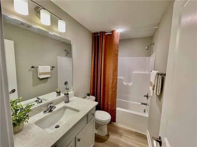 5428 153rd St, Urbandale, IA 50323 - full bathroom featuring toilet, wood finished floors, vanity, and shower / bath combination with curtain