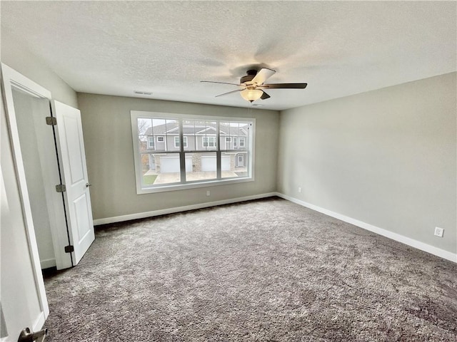 5428 153rd St, Urbandale, IA 50323 - unfurnished bedroom featuring carpet, baseboards, a textured ceiling, and ceiling fan